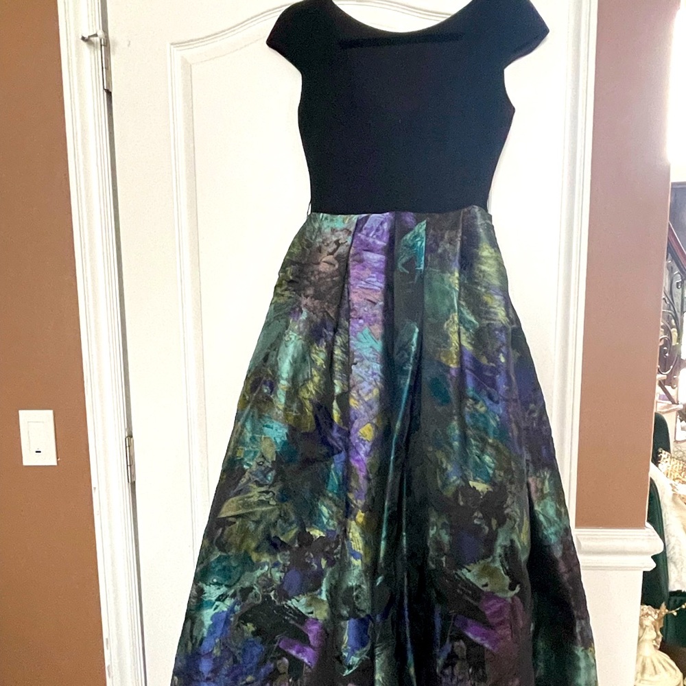 Ball gown, black top with patterned ball gown bottom, with pockets